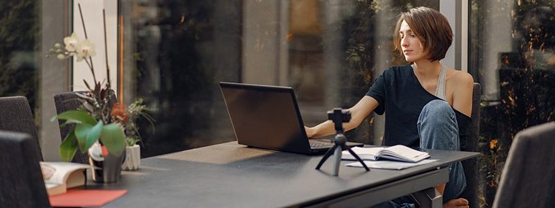 Woman working at home. Businesswoman on quarantine. Lady shoots a blog.